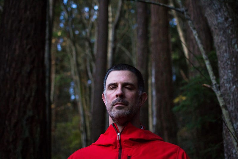 Philip Burns, a counselor at Western’s Health Center, meditates in the Sehome Hill Arboretum. Burns tries to use mindfulness in his everyday life and meditates by paying attention to how he is feeling and what he is thinking, he says.