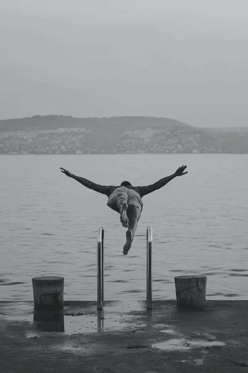 Man diving headfirst into a lake
