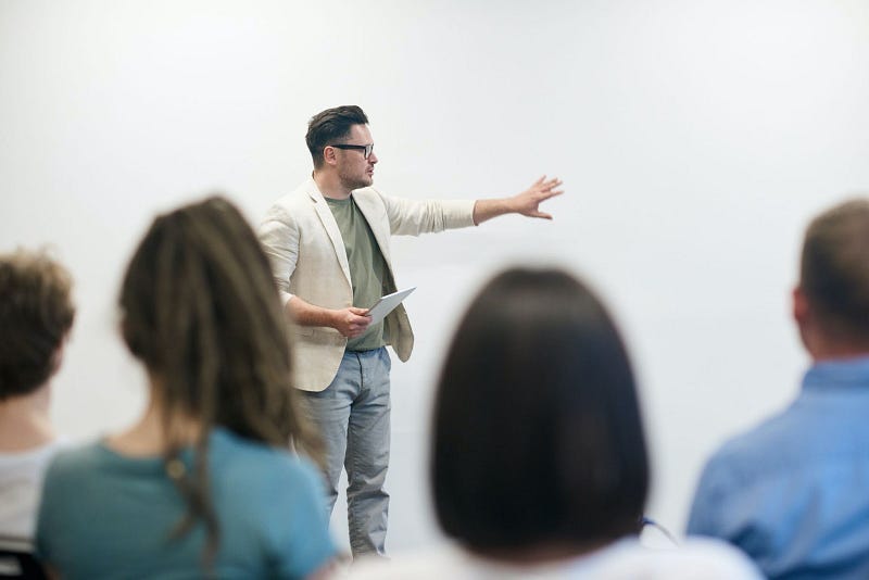 man explaining to a team