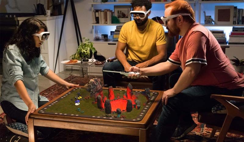 people wearing Tilt Five headsets gathered around a table playing a tabletop RPG
