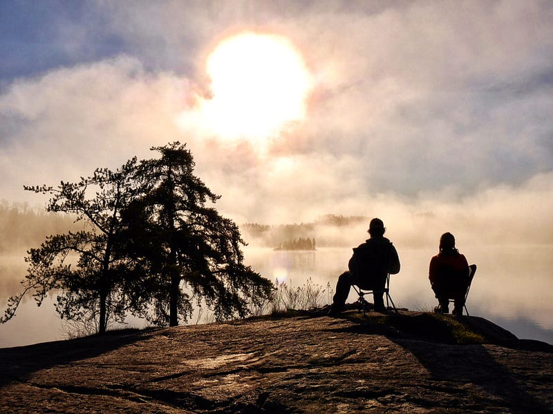 Dave and Amy enjoy the view over the lake as dusk sets in.