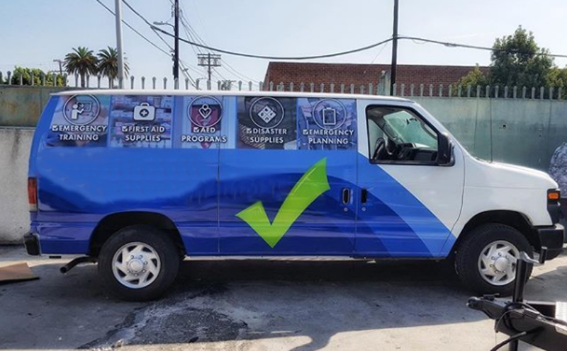 A van covered with icons that have text below them that convey their meaning