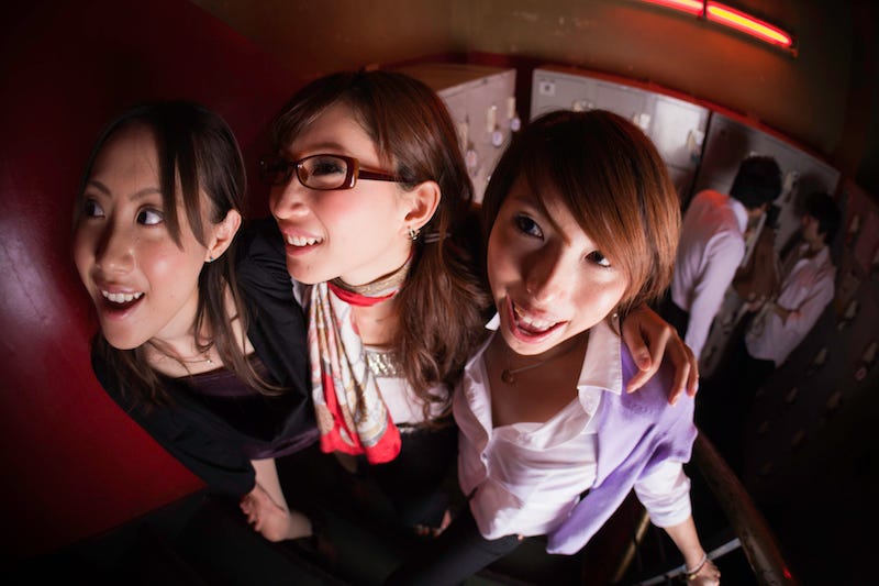 Three girls in Japan get ready to go out clubbing and take a photo of themsleves