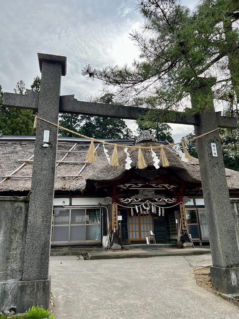 Torii gate entrance to shrine lodging.
