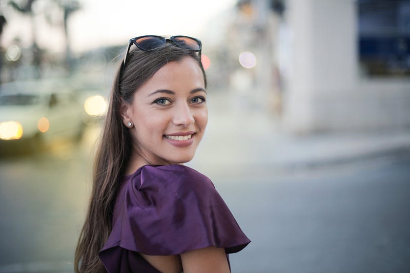 A portrait of a woman looking in the camera.