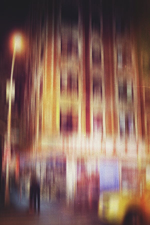 Abstract motion blur photograph of city streets in Lima, Ohio, capturing streaks of light and urban movement — fine art by Dan Sproul.”