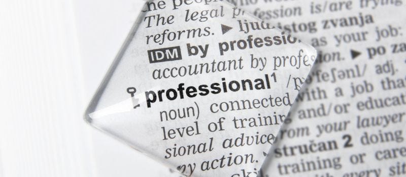 the word “professional” on a piece of paper