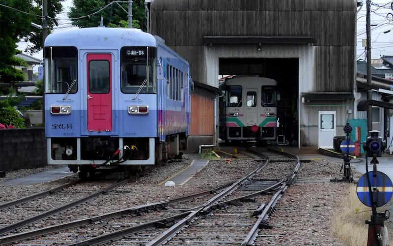 Trains pull into a rural station in Asakura, Fukuoka.