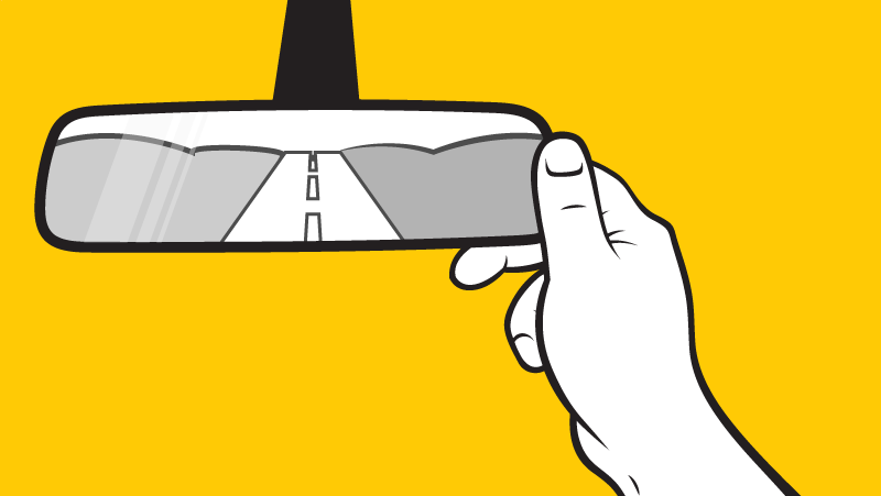 An illustration of a hand adjusting a rearview mirror