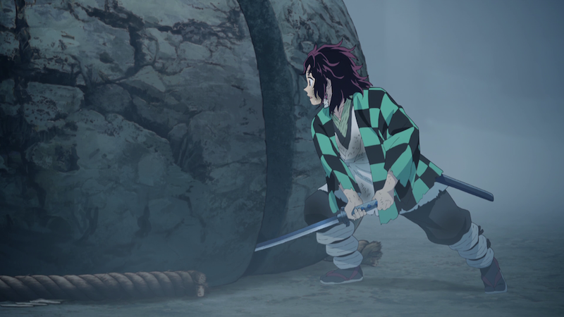 Kamado Tanjiro from Kimetsu no Yaiba cuts a boulder in two after his bout with Sabito—The scene was inspired by Yagyu Villages’s Itto-seki