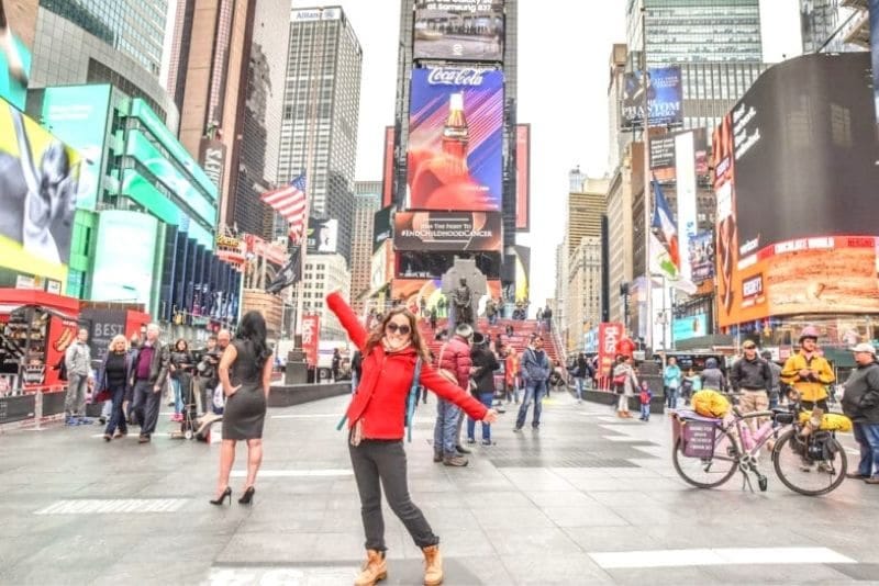 woman posing near the Red Steps of Times Square