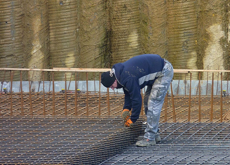 person assembling rebar