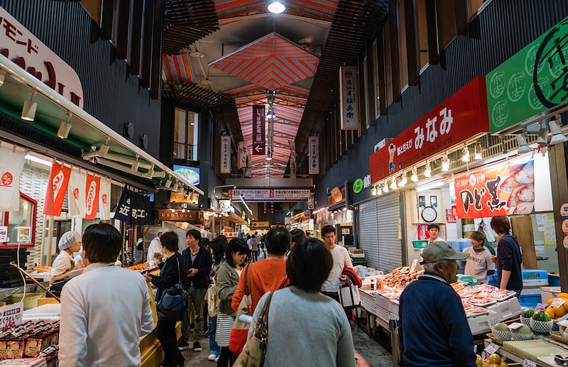 People shopping at Kanazawa’s Omicho Fish Market in Ishikawa Prefecture