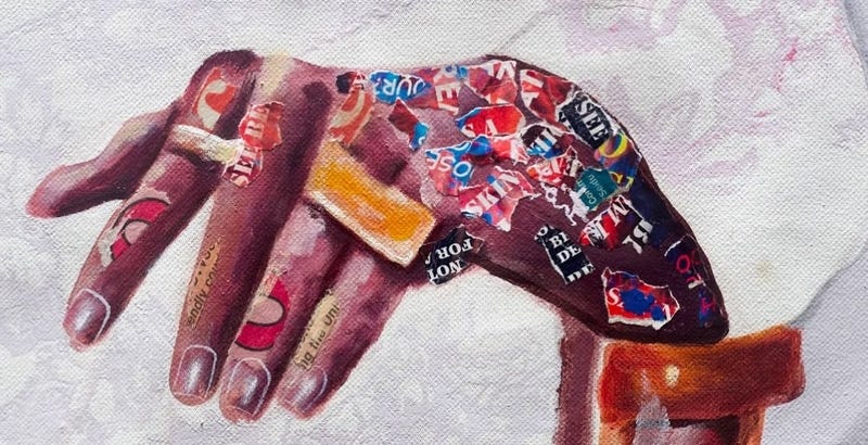 A close up of a hand in one of Taku’s prints. The black hand has one ring on the index finger and a double ring on the ring and pinky finger. At this zoom, you can see that the hand has magazine text as a collage along the hand.