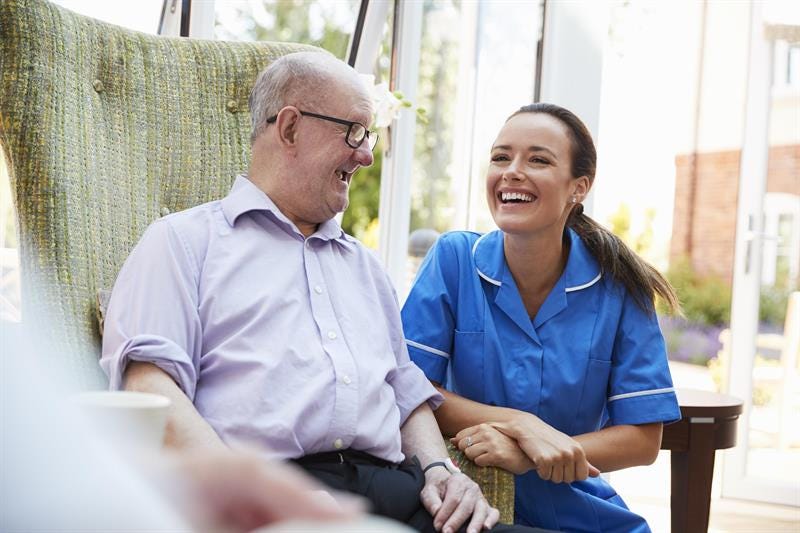 Happy nurse with patient