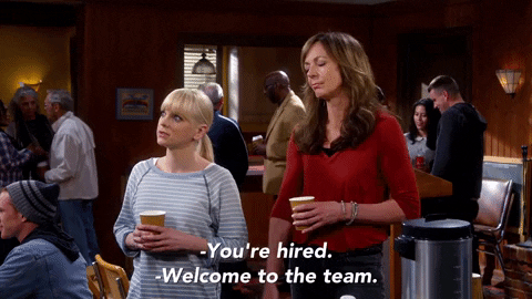 Gif of a man and woman shaking their hands with the caption "You're hired. Welcome to the team"