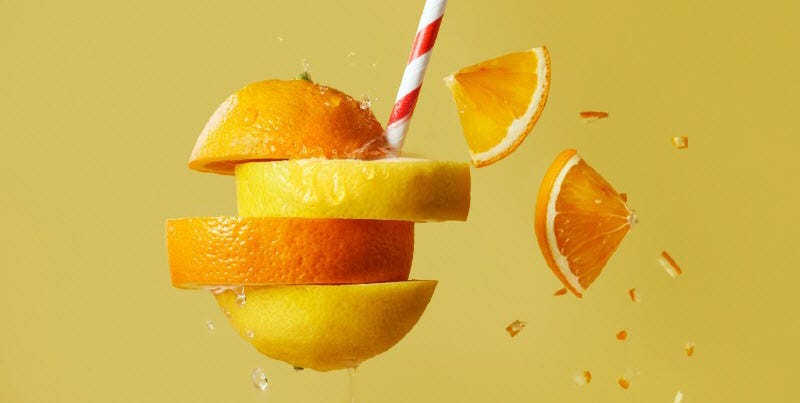 orange and lemon slices on a straw