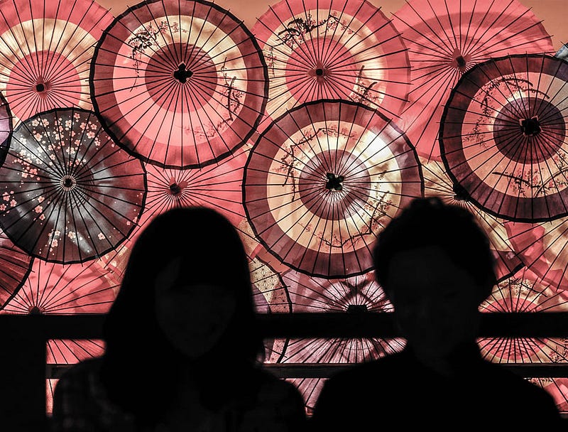 Traditional Japanese umbrellas are lit up as decorations at Tsukioka Onsen in Niigata Prefecture