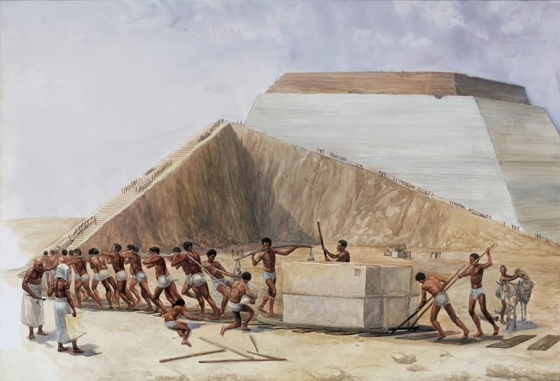 Egyptian workers dragging a large sandstone block — building pyramids