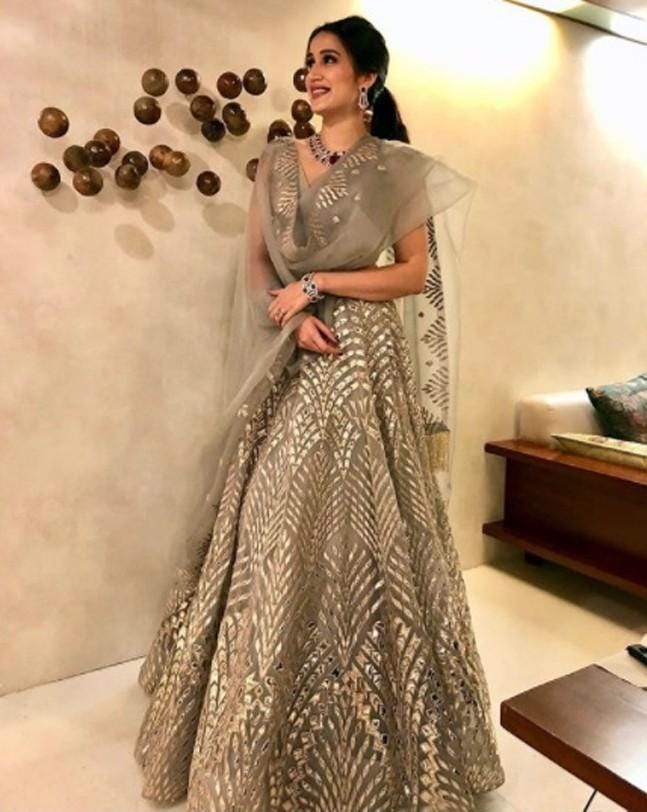 Sagarika’s lehenga by Falguni Shane Peacock in pastel color