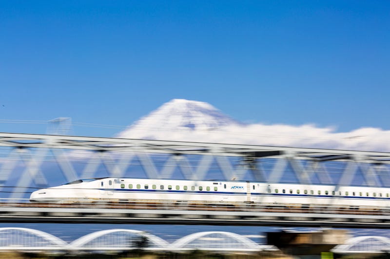 Someone using their JR Rail Pass speeds by Mt. Fuji on a bullet train