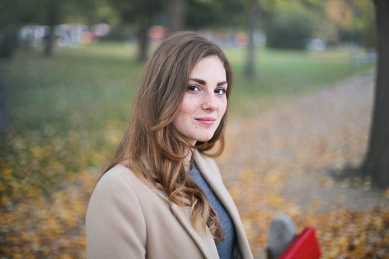 A potrait of a woman in the park.