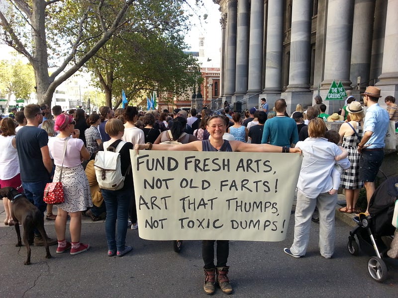 my sign at the rally against the proposed $8.5million cuts to South Australian arts funding "Fund Fresh Arts, Not Old Farts! Art That Thumps, Not Toxic Dumps!"