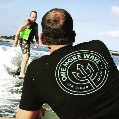 Man with prosthetic leg learning to surf as an alternative PTSD treatment