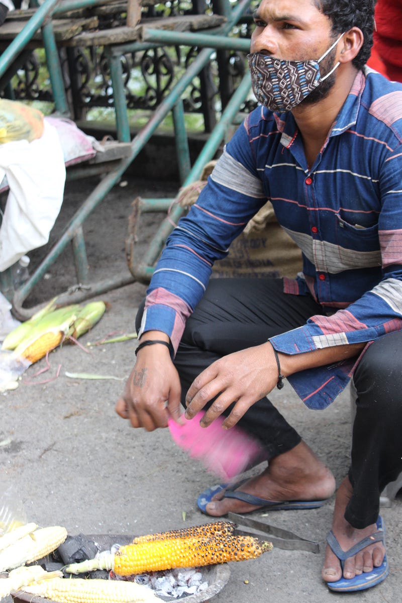 Man Selling Bhutta(Corn).