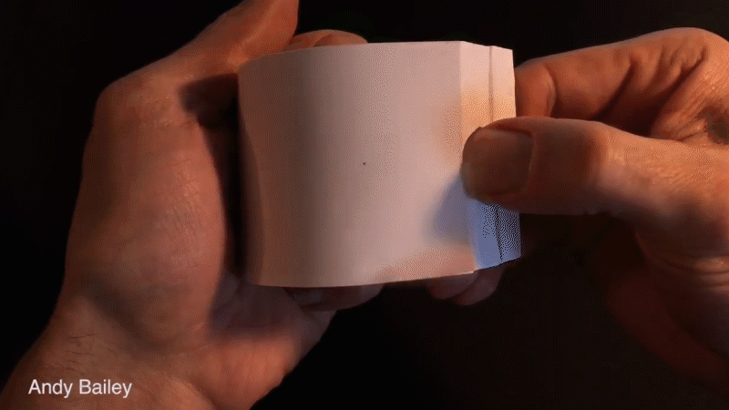Hands holding and flipping through a flip book