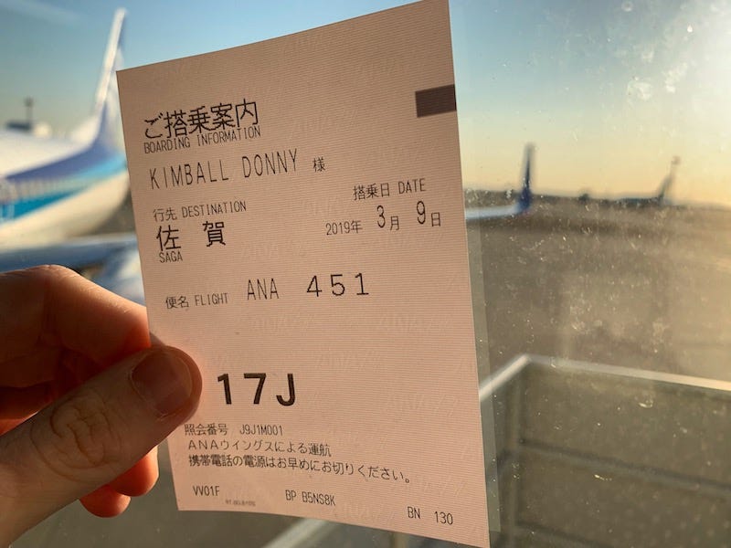 Donny Kimball holds an ANA ticket for a flight to Saga Prefecture