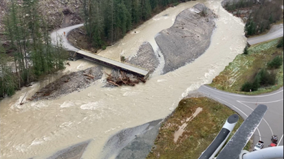 Near Coquihalla, British Columbia, a bridge was washed out by flood waters on Highway 5.