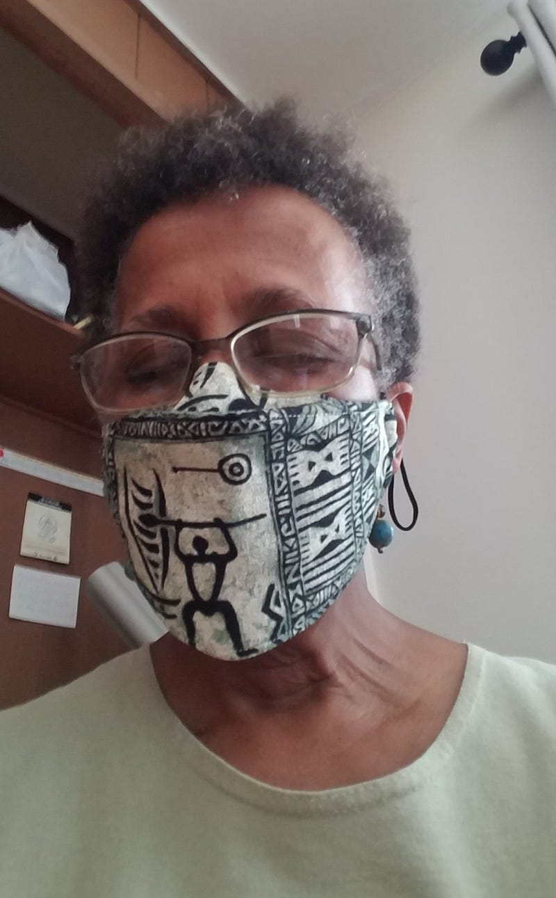 Photo of Patrice Walker wearing a face mask made with Hawai’ian print fabric.