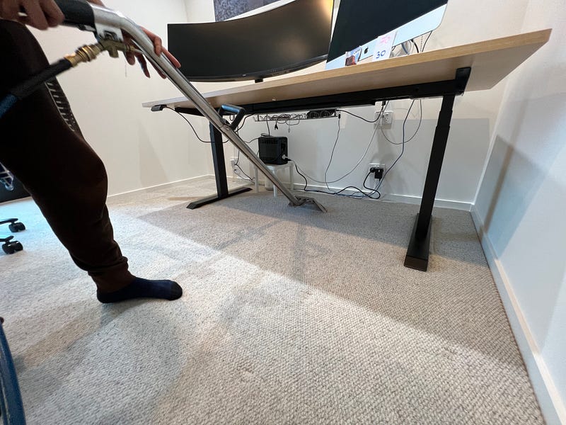 Professional cleaners performing eco-conscious office cleaning to reduce environmental impact