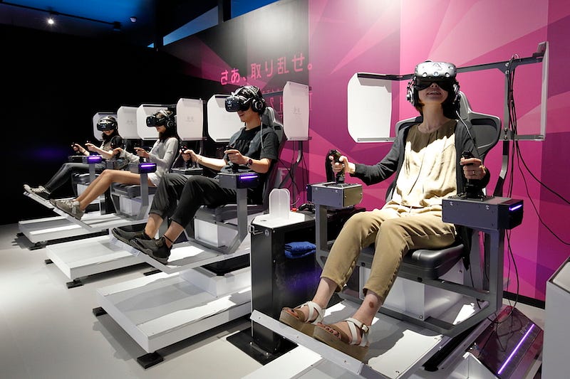 A group of people enjoy an attraction at Tokyo’s VR Zone Shinjuku