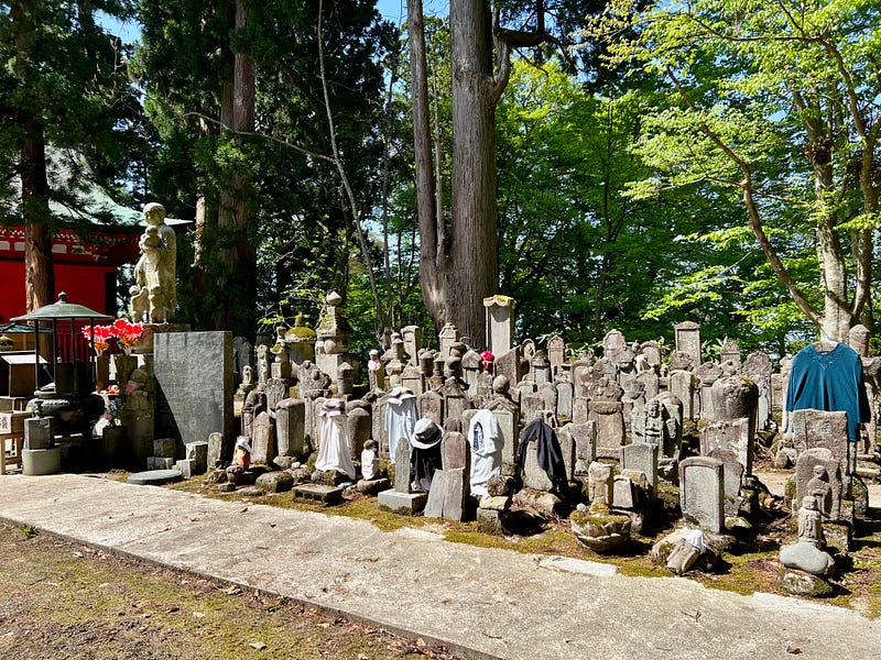 Gravestones, some wearing shirts.