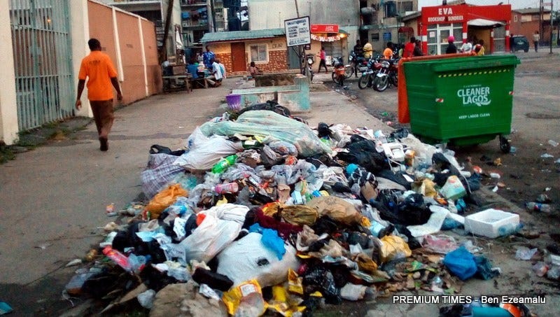 Street with garbage on the sidewalk