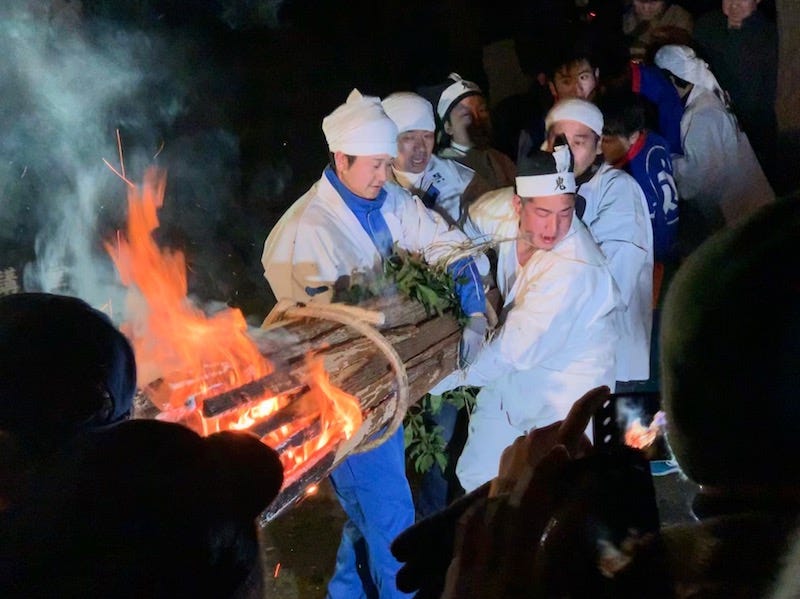 Man hold a bundle of flaming branches as part of the Shujo Onie on Oita Prefecture’s Kunisaki Peninsula