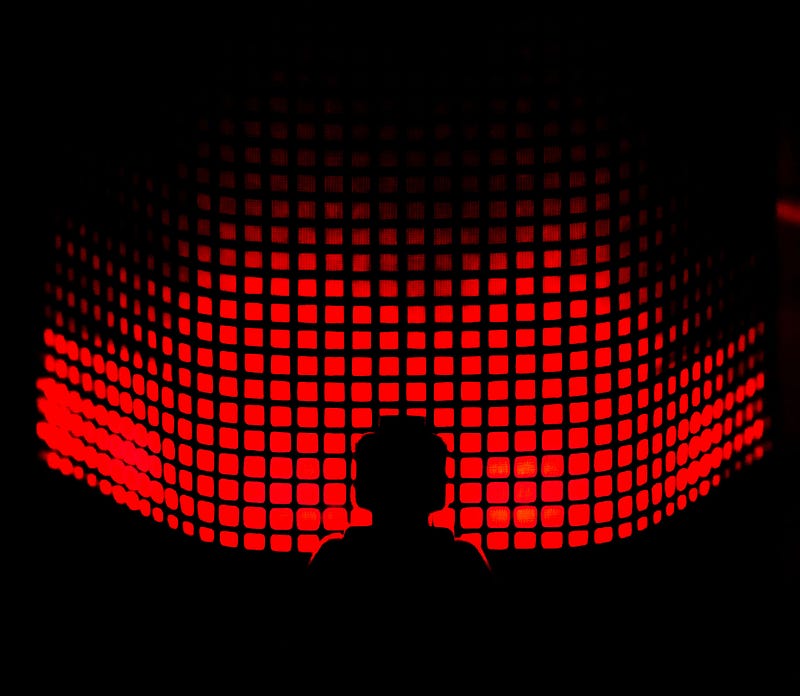 lego person staring at a black screen with red squares