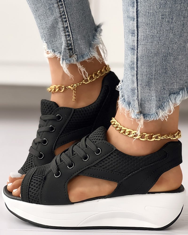 These sandals feature an open toe design, lace-up closure, and a thick sole that adds height and provides stability — from Bikiniomni.com
