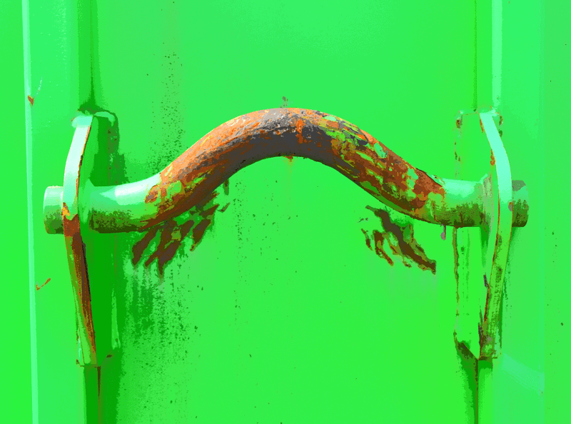 Close up of green painted rusty metal handle