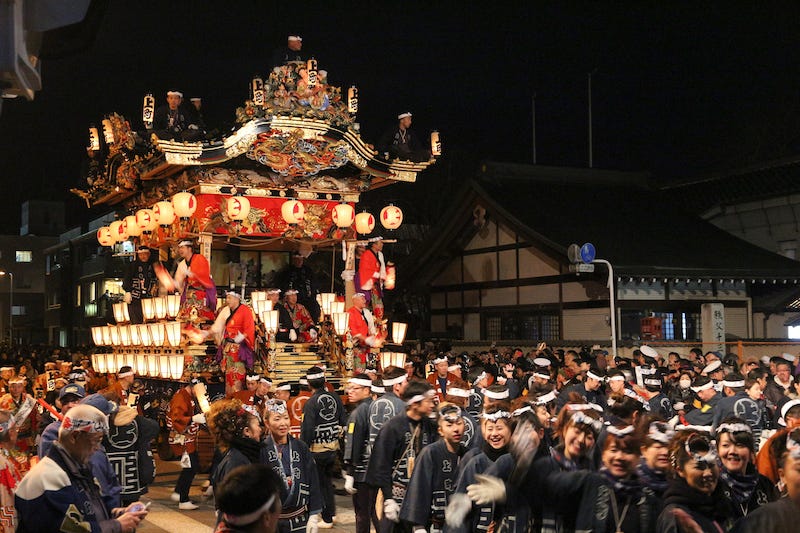A bunch of revelers pull one of many night floats from the Chichibu Night Festival