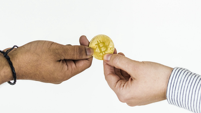 image of physical coin displaying how to buy bitcoin peer to peer