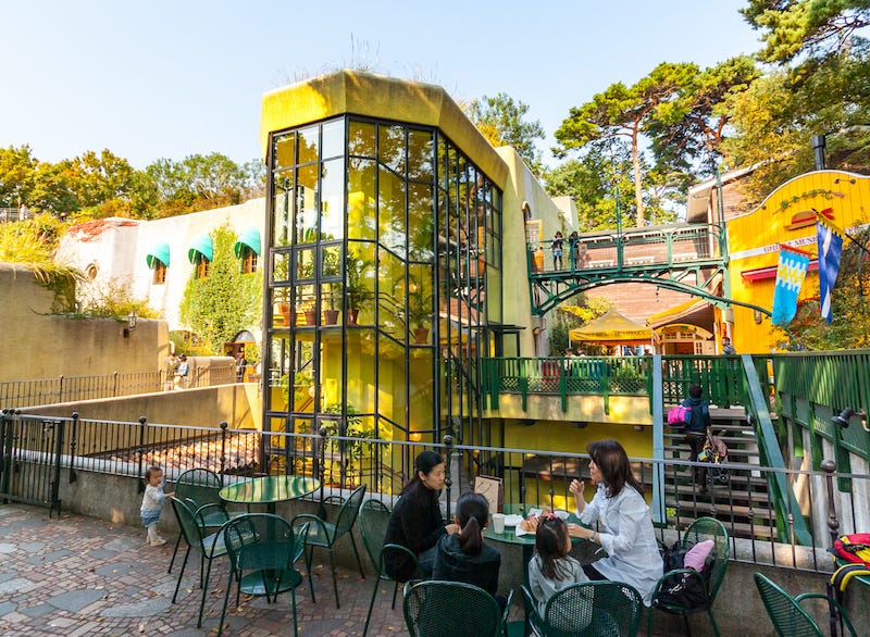 A family sits outside of Tokyo’s Ghibli Museum