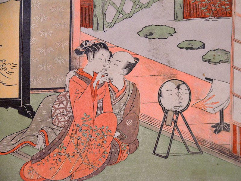 A piece of ukiyo-e art depicts an Edo period (1603–1868) couple kisses in Yoshiwara