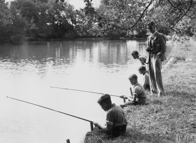 Four children fishing in a lake.