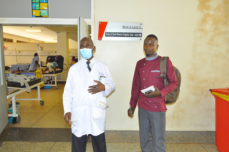 Dr Edga Michael Muhumuza with the author. Credit: Peter Ssuuna.