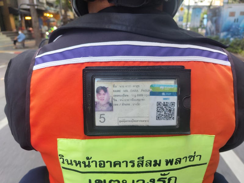 The ID on the back of a win drivers jacket. The win name and his number are below. 📸: the author.