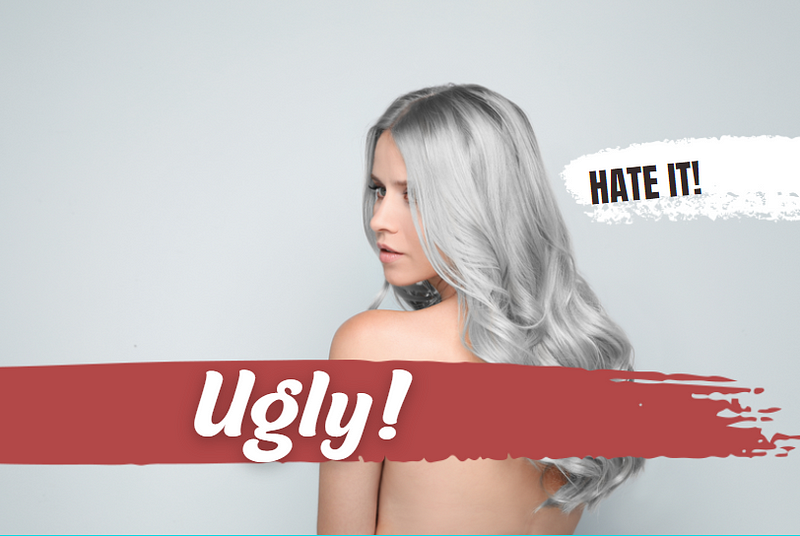 Woman with gray hair on light background. Hate it and Ugly above her hair.
