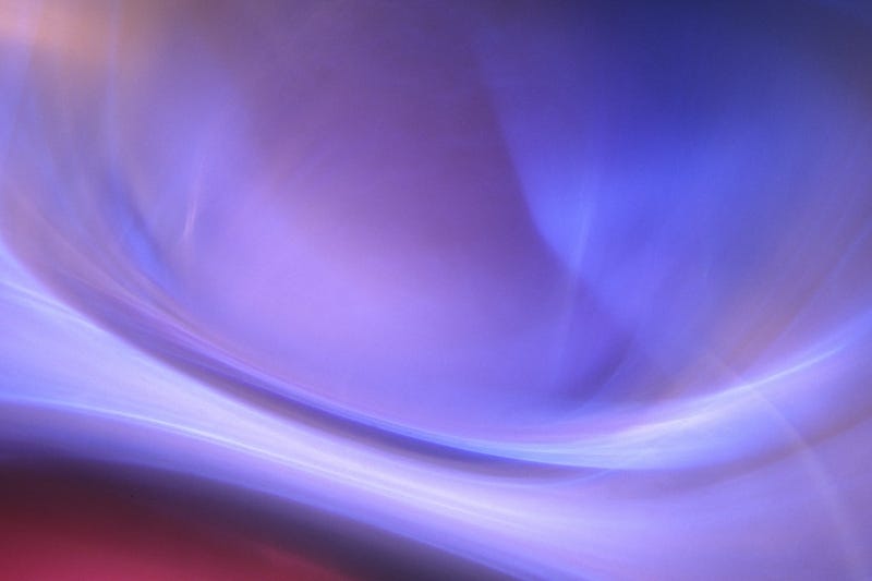 Abstract photograph with gentle red, purple, and blue tones, created for healing by a medical doctor